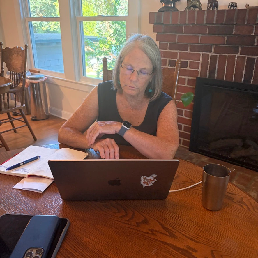 Maggie Greer reviewing partner materials