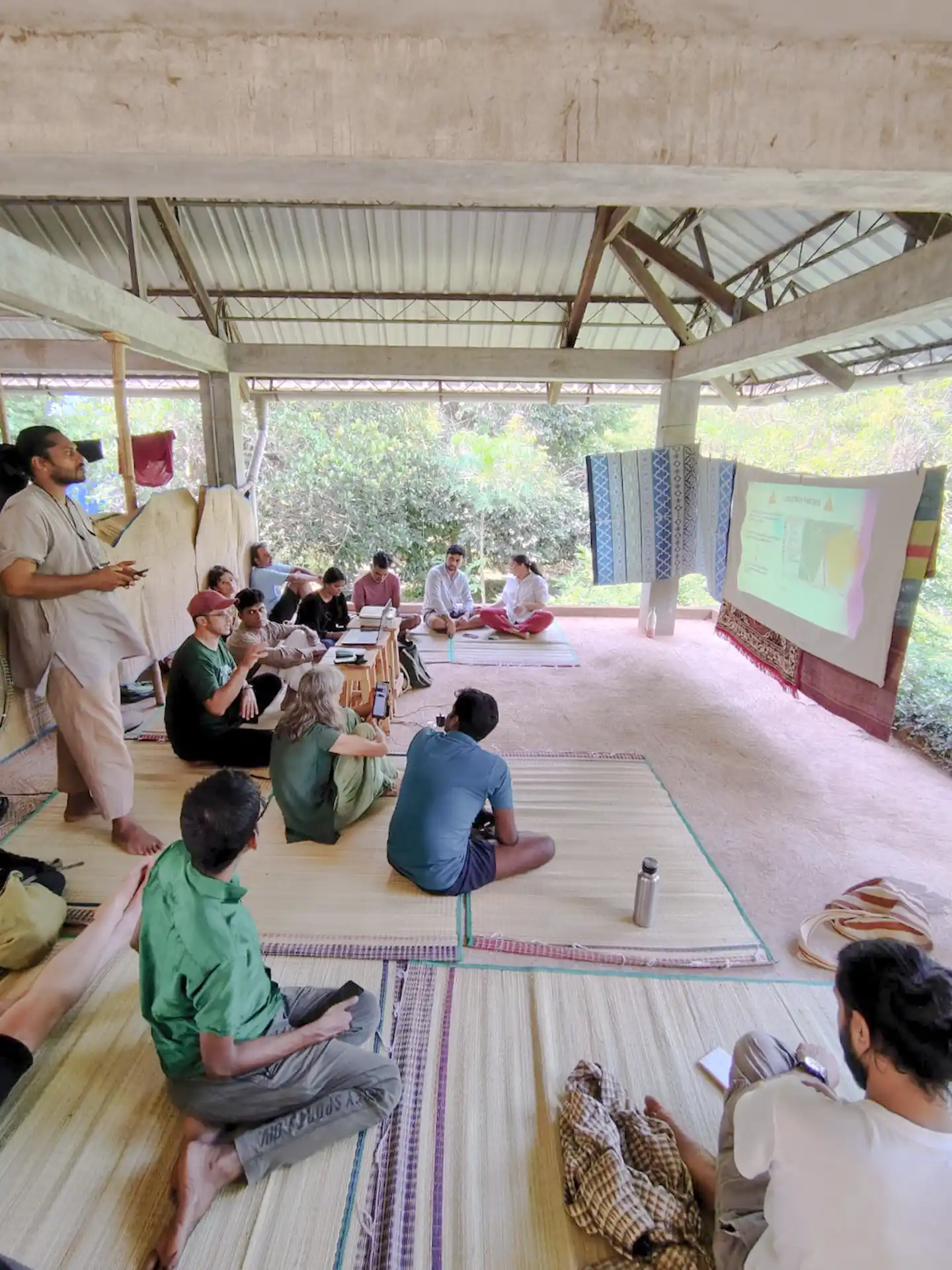 Andrés Acosta Calderón with participants at AuroOrchard