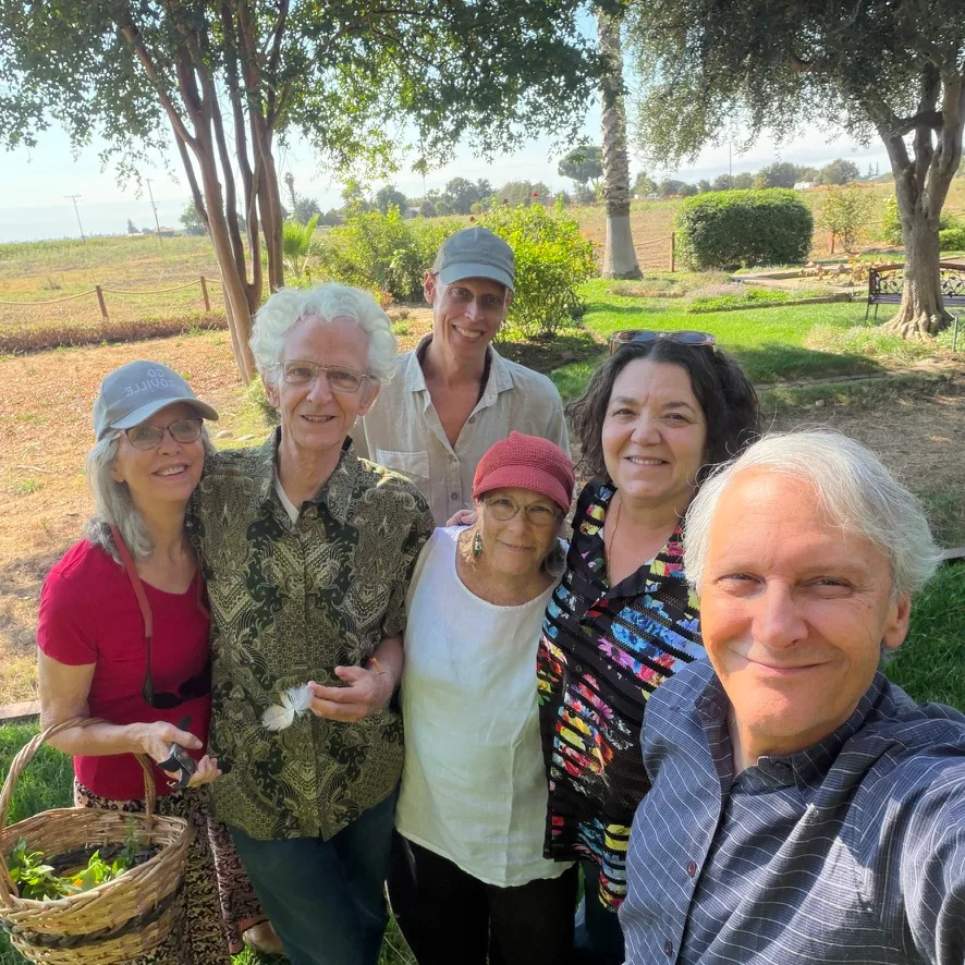 AVI USA board members together in the garden at Sri Aurobindo Sadhana Peetham, Lodi