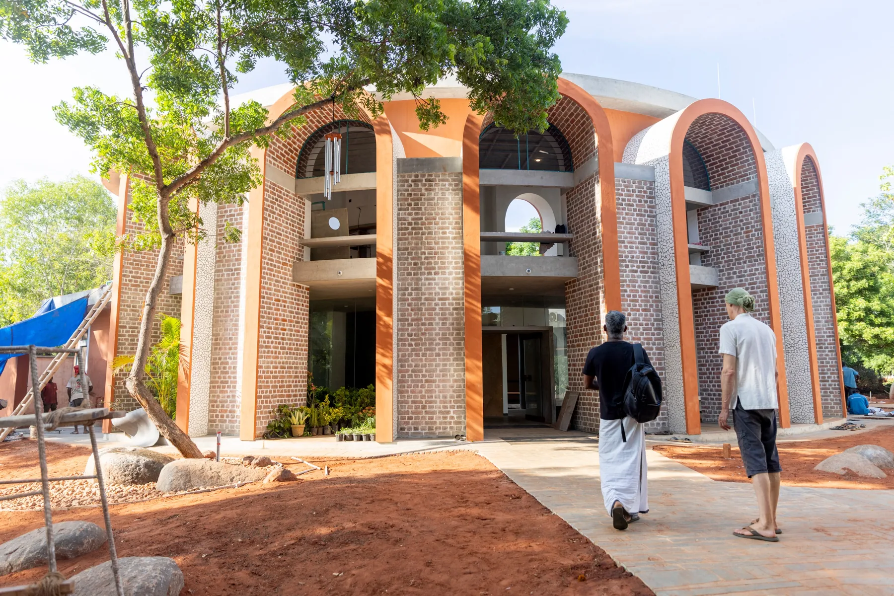 The arched brick facade of the new MorningStar Birthing Center in Auroville