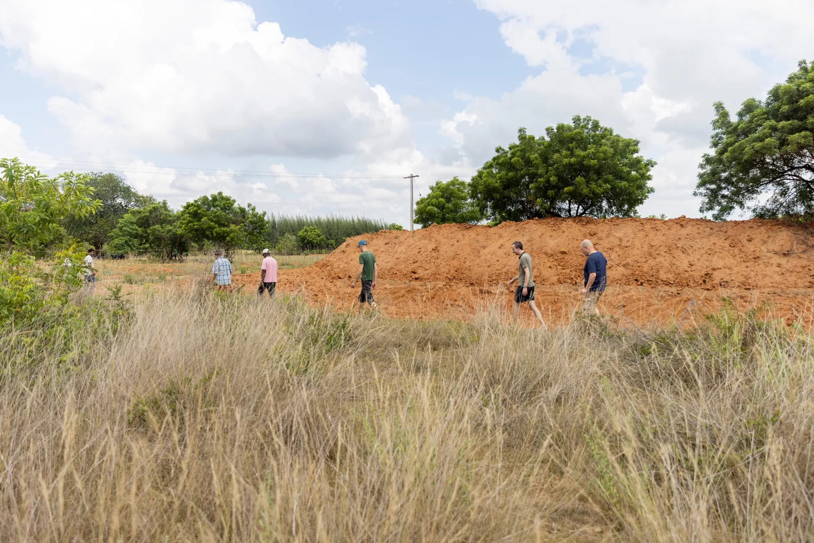 Walking past a freshly dug earth bund at Sadhana Forest