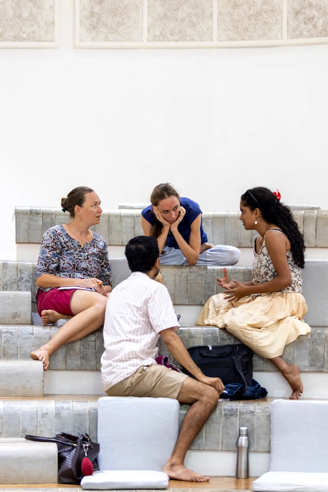 Four partners in a breakout group on the steps