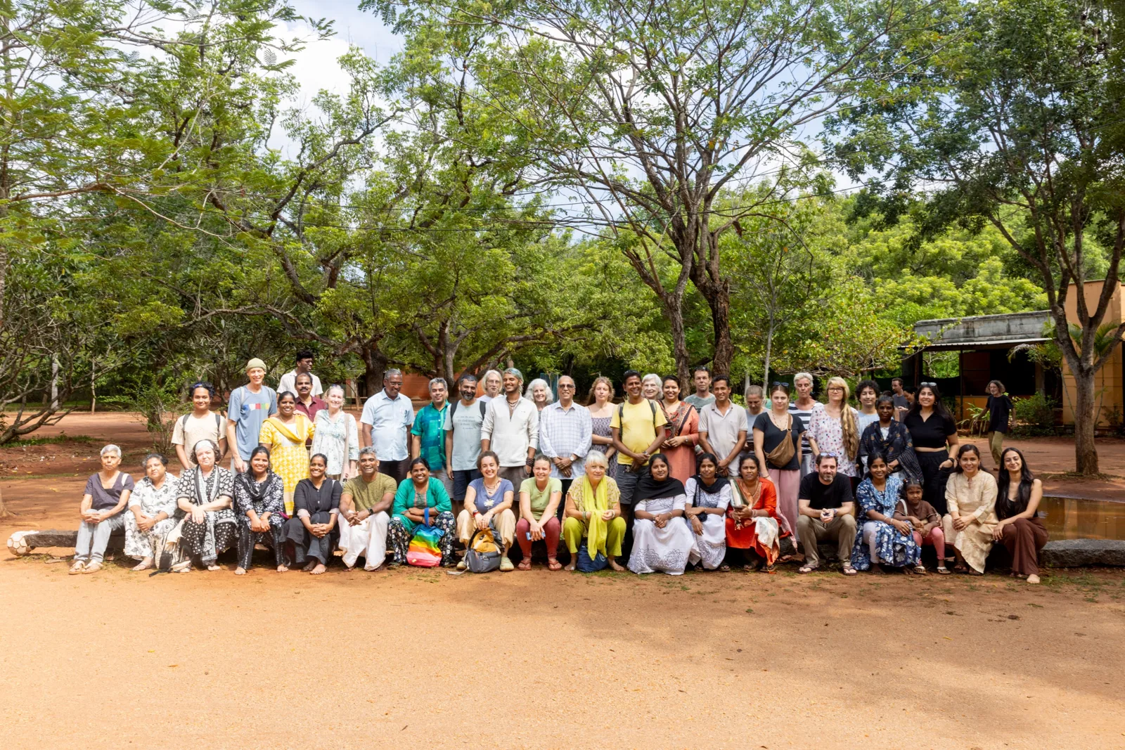 AVI USA project partners gathered under the trees at Transition School