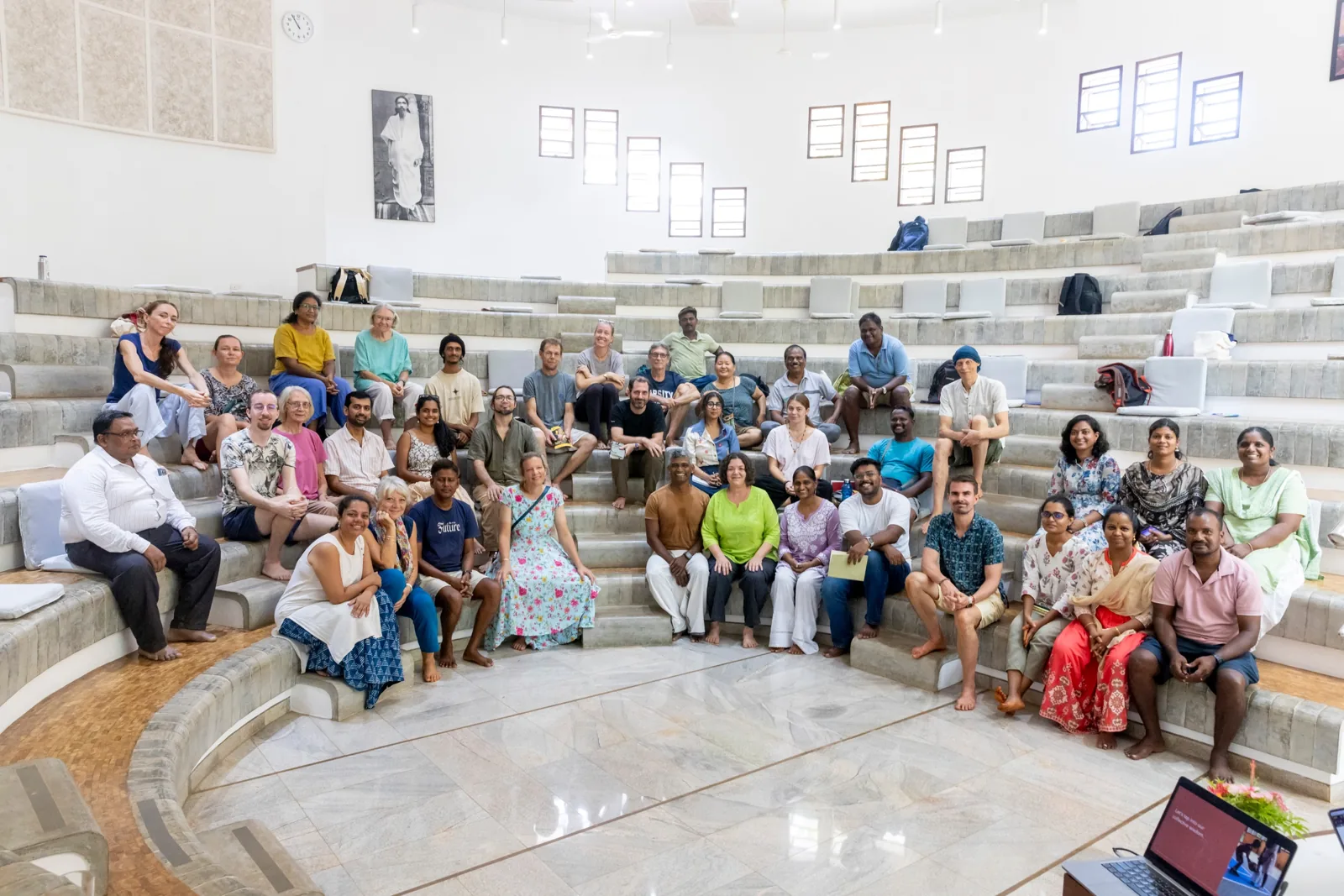 Workshop participants together on the steps of the hall at Savitri Bhavan